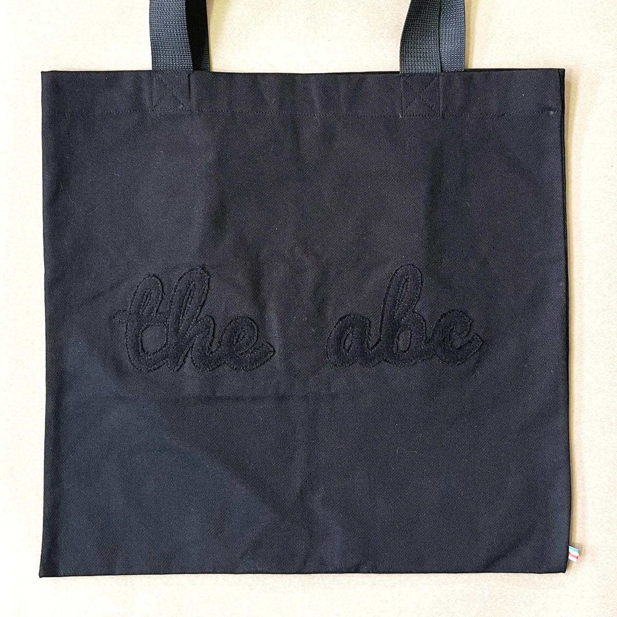 Flat theabc logo tote bag